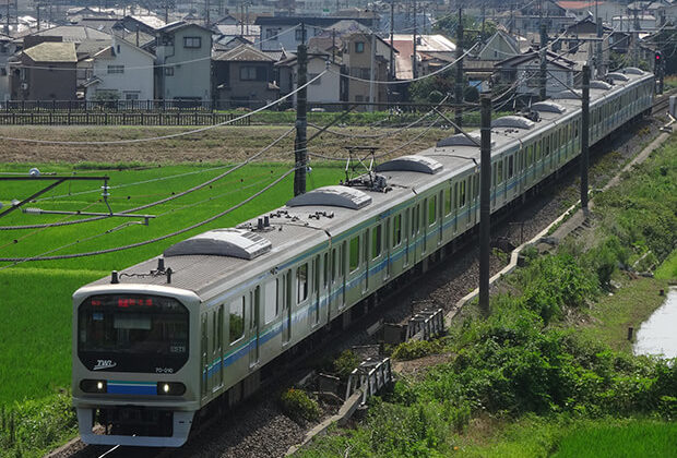 The Rinkai Line traveling through spring leaves